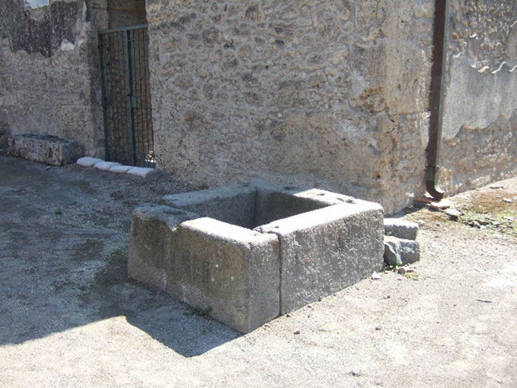 Fountain outside I.16.4 Pompeii. September 2005. Looking south-east towards entrance doorway