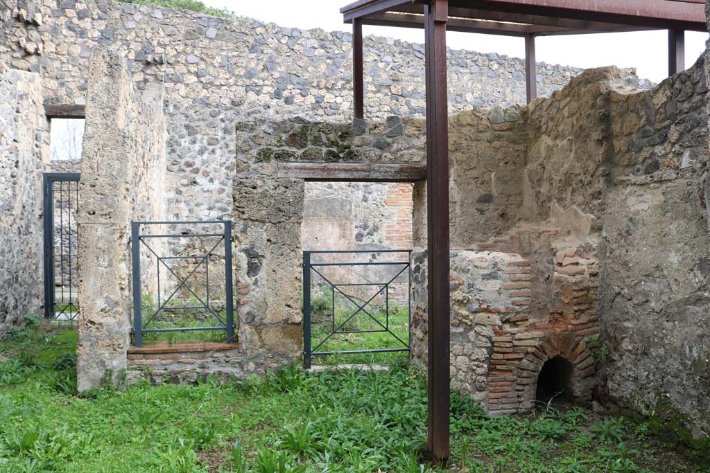 I.20.3 Pompeii. December 2018. 
Looking east across rear room towards entrance doorway, on left, and doorways to I.20.2, on right. Photo courtesy of Aude Durand.
