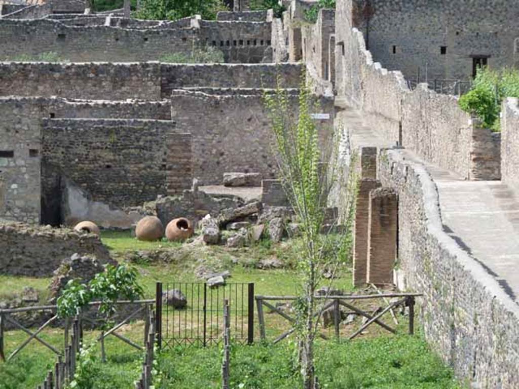 I.22.2 and I.22.3 Pompeii. May 2010. Looking north from the rear.