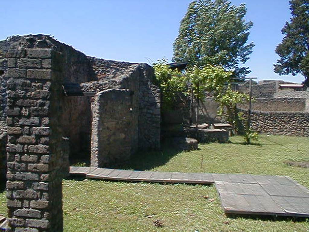 II.1.8 Pompeii. May 2005. Looking north across garden from doorway.