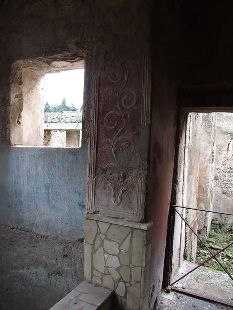 II.4.6 Pompeii. December 2006.  
Frigidarium/apodyterium, detail of west side, and doorway to tepidarium or warm bath-room with remains of a black and white mosaic threshold.
