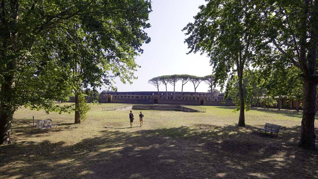 II.7 Pompeii. August 2021. Looking east across palestra towards pool and amphitheatre. Photo courtesy of Robert Hanson.