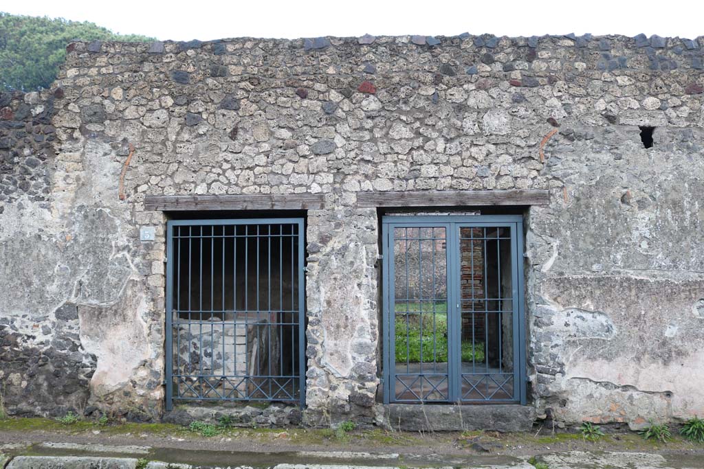 II.8.2 Pompeii, on right. December 2018. 
Looking east on Via di Nocera towards entrance doorways, with II.8.3, on left. Photo courtesy of Aude Durand.
