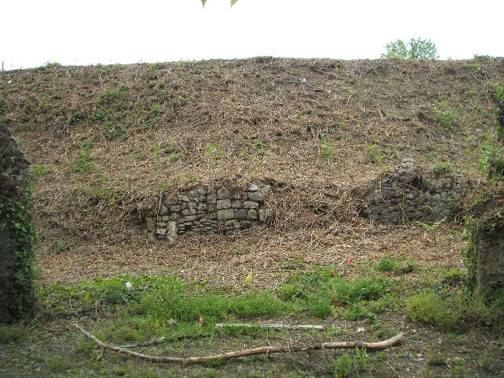 III.11.3 Pompeii. May 2005.  Shop entrance on the right.  III.11.4 is on the left.

It is difficult to reconcile the entrances in this insula with the plans as the entrances onto Via Nola have been filled in or are unexcavated.
