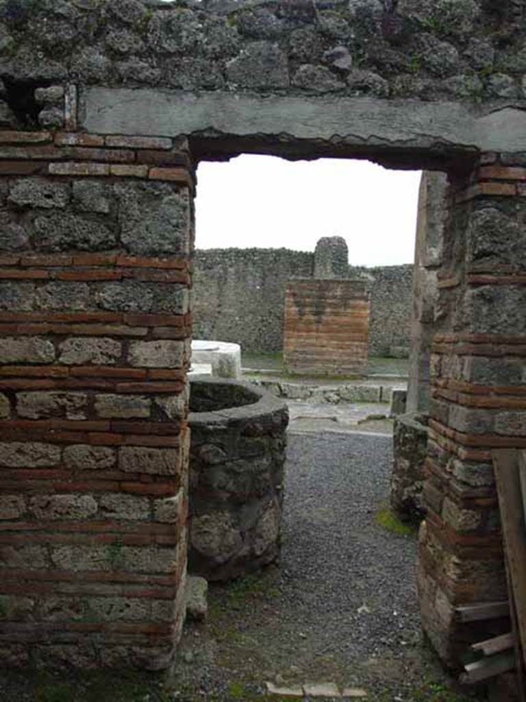 V.1.4 Pompeii. May 2010. Rear room, looking south through doorway to entrance on Via di Nola.