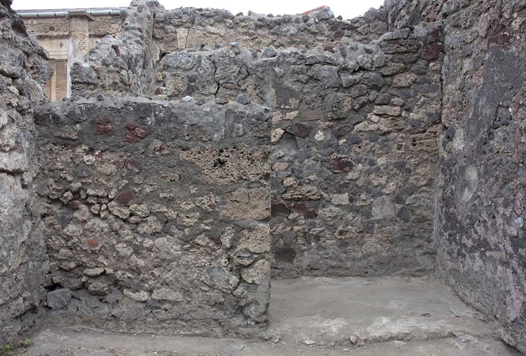 V.1.7 Pompeii. c.2005-7. Room “a”, north wall, with room 12, on right. Photo by Hans Thorwid. 
Photo courtesy of Swedish Pompeii Project.
