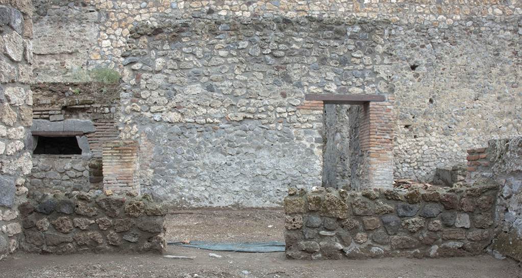 V.1.15 Pompeii. Post 2008.  Room “g”, south wall. Photo by Hans Thorwid.  
“South wall after restoration in 2008, with door opening wrongly constructed as located in the centre of the wall.”
Photo and words courtesy of the Swedish Pompeii Project.
