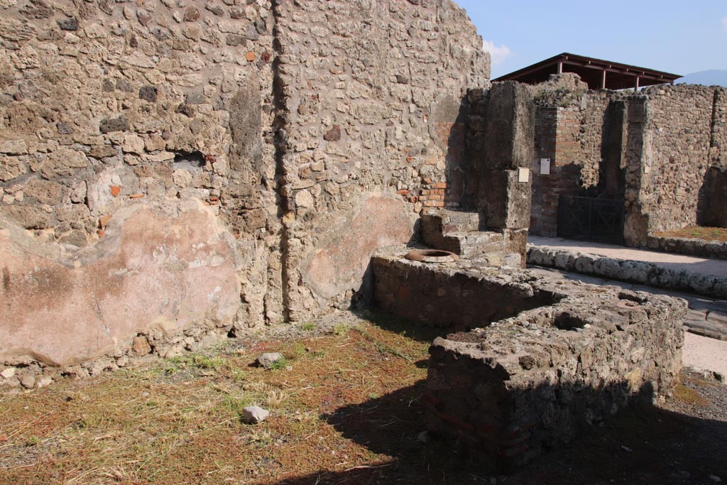 V.2.13 Pompeii. October 2022. Looking south-east across bar-room and counter. Photo courtesy of Klaus Heese.