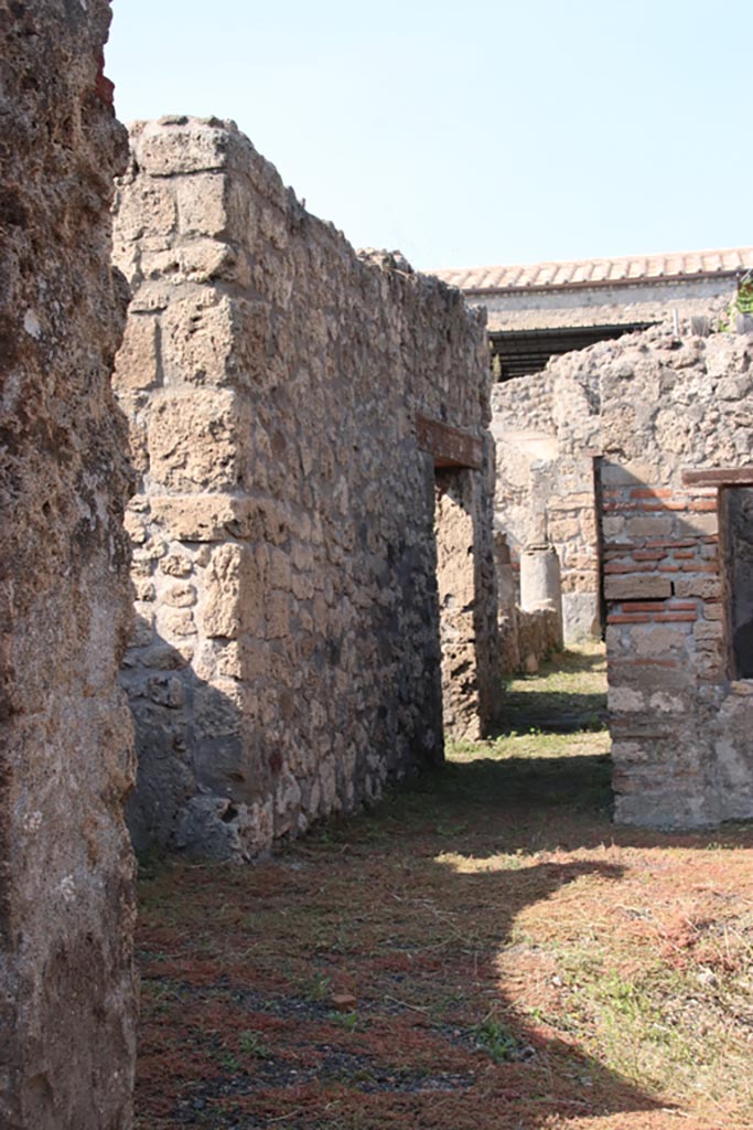 V.2.15 Pompeii. October 2022. 
Room 3, corridor leading to peristyle, looking north from atrium. Photo courtesy of Klaus Heese.
