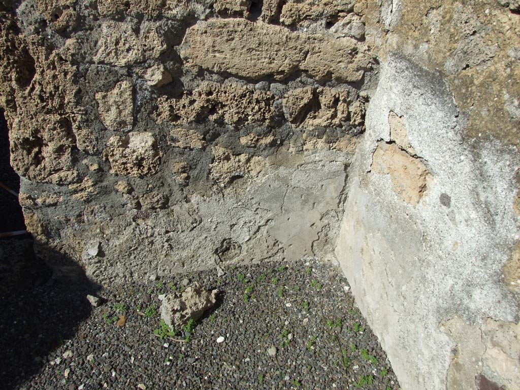 V.3.8 Pompeii. March 2009. North-east corner of large room behind oven. 