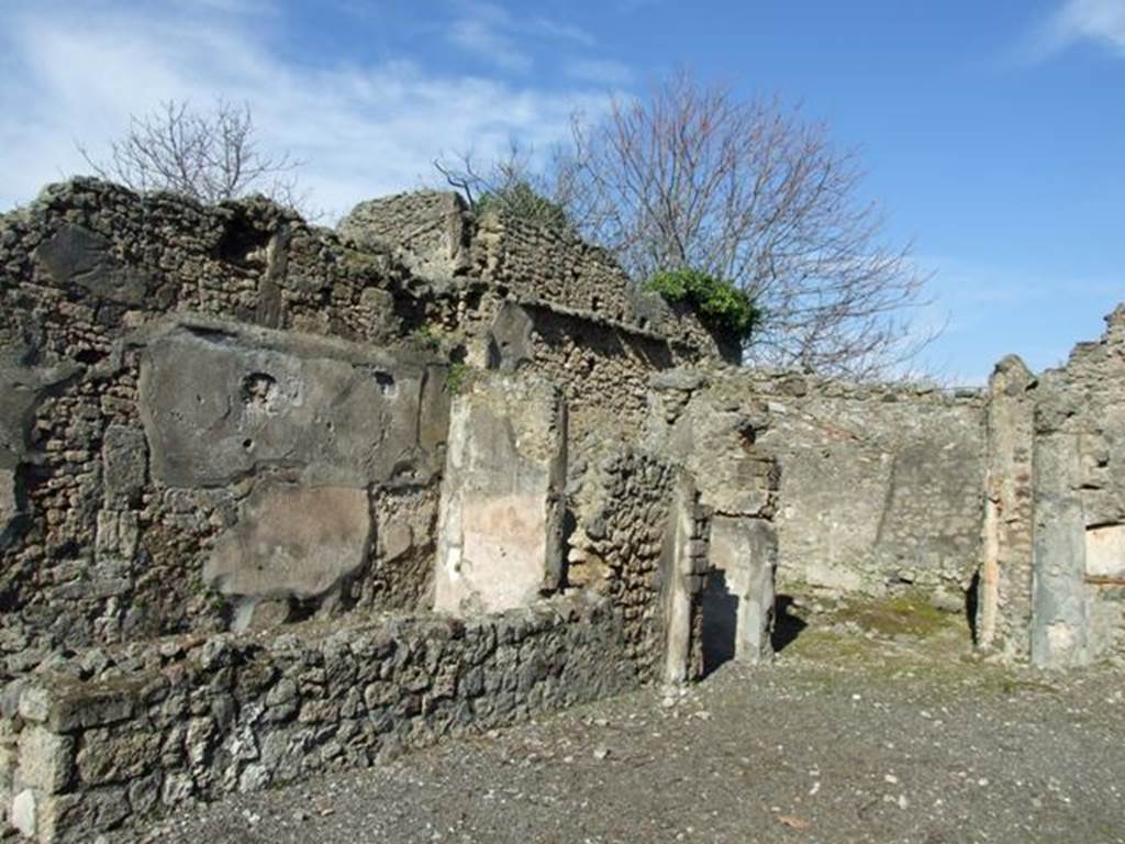 V.4.b Pompeii.  March 2009.  Exedra on north side of atrium. On the south side of the Exedra, would have been another small room and staircase to upper floor. On 16th September 1943 a bomb fell here, destroying the prothyron, the atrium and some rooms to the north.