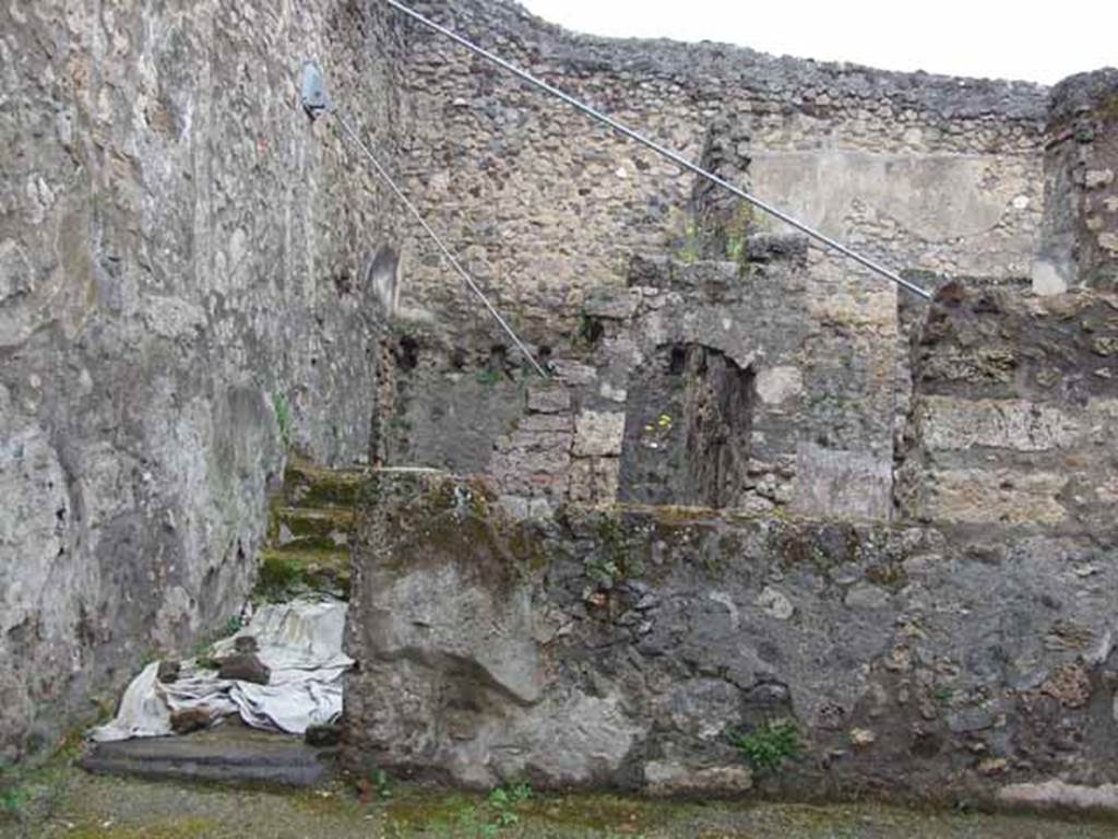 V.5.2 Pompeii. May 2010. West side of atrium, doorway to courtyard or light-well, with steps to the upper floor.