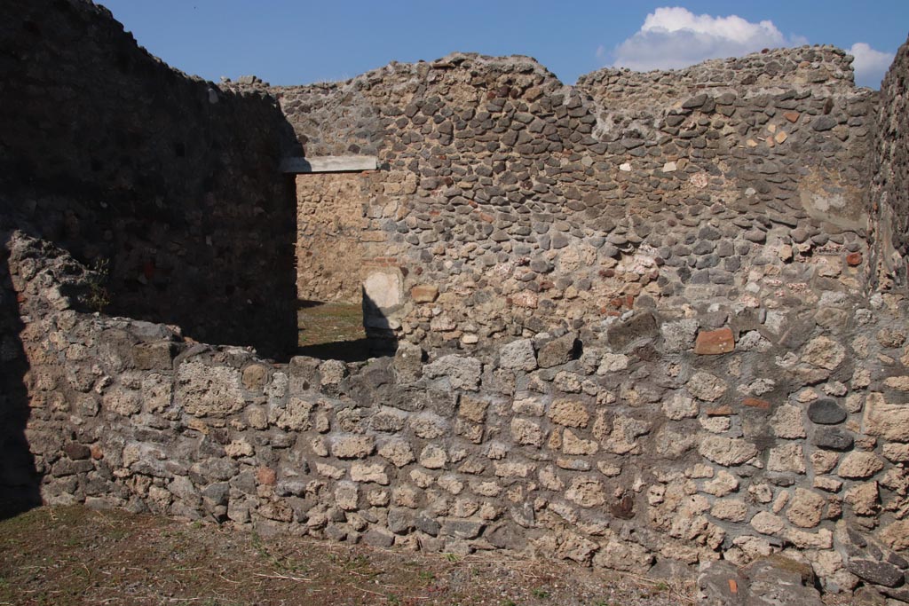 VI.7.13 and VI.7.14 Pompeii. October 2022. 
Looking towards north wall of shop, with large room of VI.7.15, at rear. Photo courtesy of Klaus Heese.
