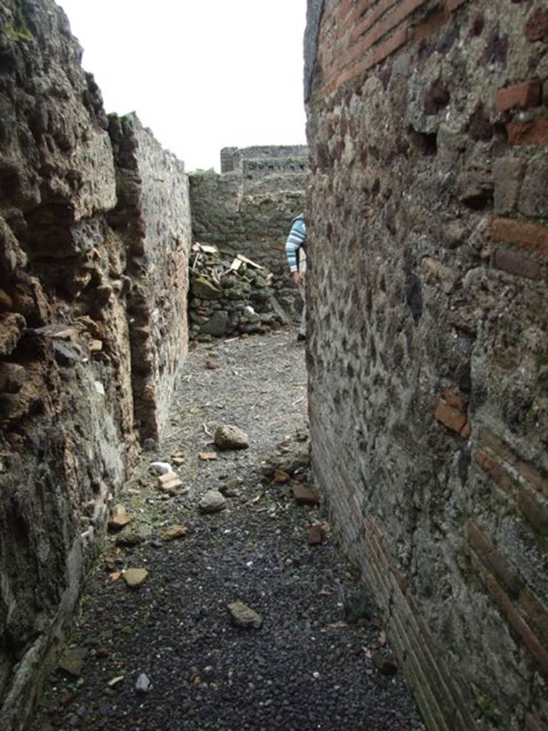 VI.9.6 Pompeii. March 2009. Corridor 26 at rear of large exedra leading to rear rooms of VI.9.7. Originally this did not connect with VI.9.7, but only led to two rustic rooms numbered 28 and 29.
