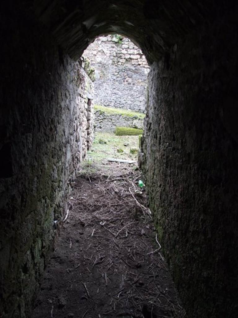 VI.9.10 Pompeii. March 2009. Passageway/corridor from three underground rooms, looking south.
The doorway into the kitchen can be seen on the left.
