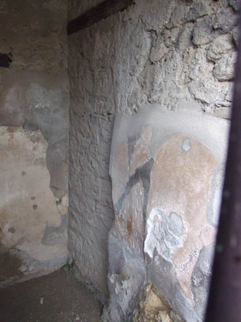 VI.10.1 Pompeii. March 2009. South-east corner, with blocked doorway in VI.10.2, and south wall of front room on south side of bar-room.  
