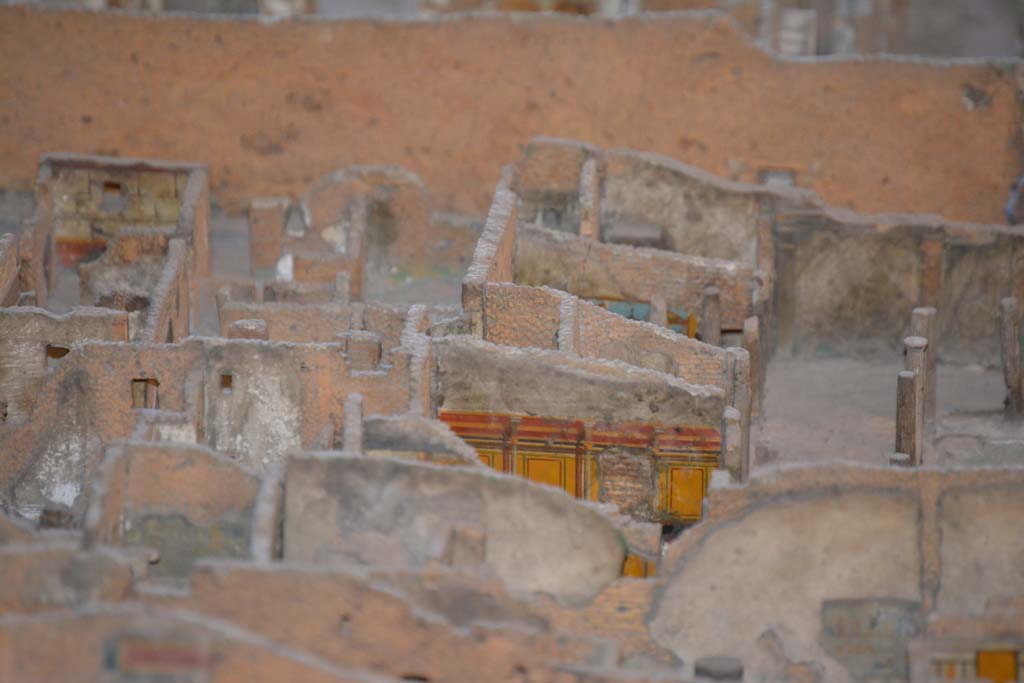 VI.11.9/10 Pompeii. July 2017. 
Looking towards east wall of peristyle 36, with east walls of rooms 40, (yellow painted, lower left), 42, 43 and 46, visible in centre.
From cork model in Naples Archaeological Museum.
Foto Annette Haug, ERC Grant 681269 DCOR.
