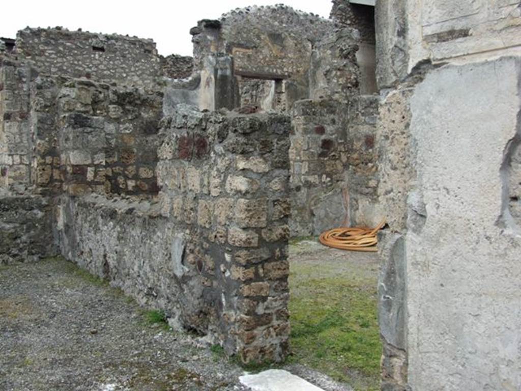 VI.11.10 Pompeii. March 2009. Room 31 on the left, and doorway into room 35 on the right. Looking west.
