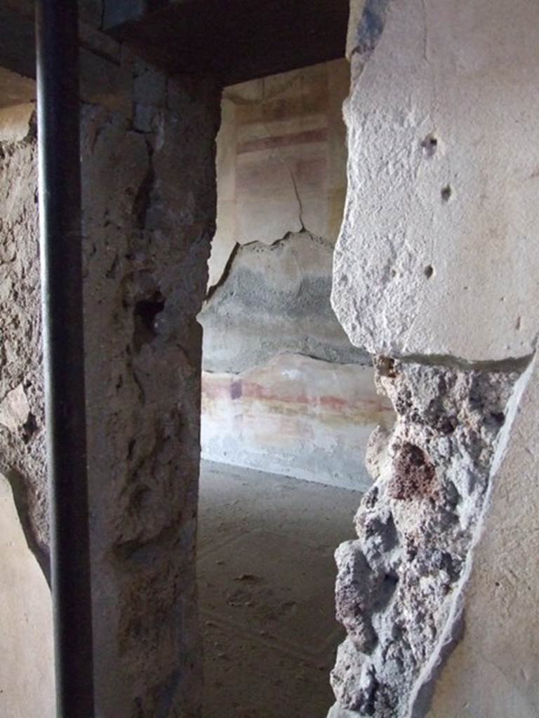 VI.11.10 Pompeii. December 2007. Room 41, looking west through break in wall of recess into room 39.