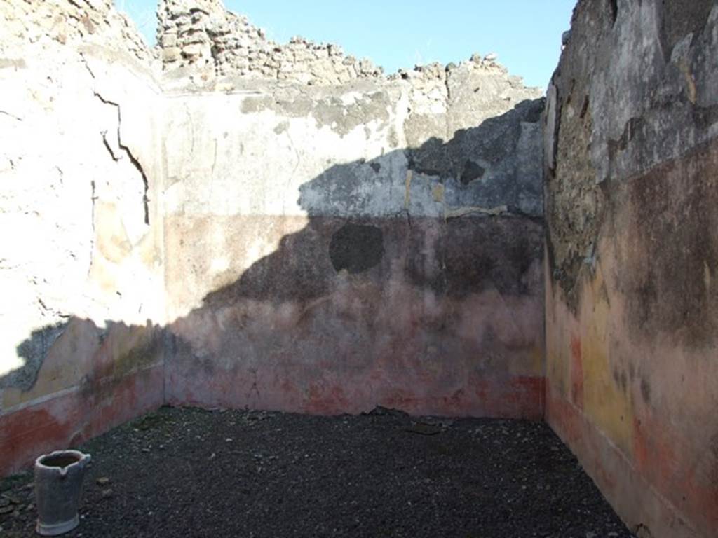 VI.14.22 Pompeii. December 2007. Room 15, east wall of triclinium. According to BdI, on this wall (the back wall) the following paintings were seen upon excavation, beginning from the left (north end): Medallion (0.41 diam) with bust of a Satyr,
Central painting (1.12 x 1.12 but hardly recognisable) on the right of it was a person sitting (0.60 high) with white long robe.,
Medallion vanished.
On the upper part of the wall was the usual fantastique architectural decoration with the following figures  On back wall from the north (left) end: A crowned man sitting on a seat, Nereide on sea-bull, Woman sitting on a seat. See BdI, 1876, (p.24-28)
