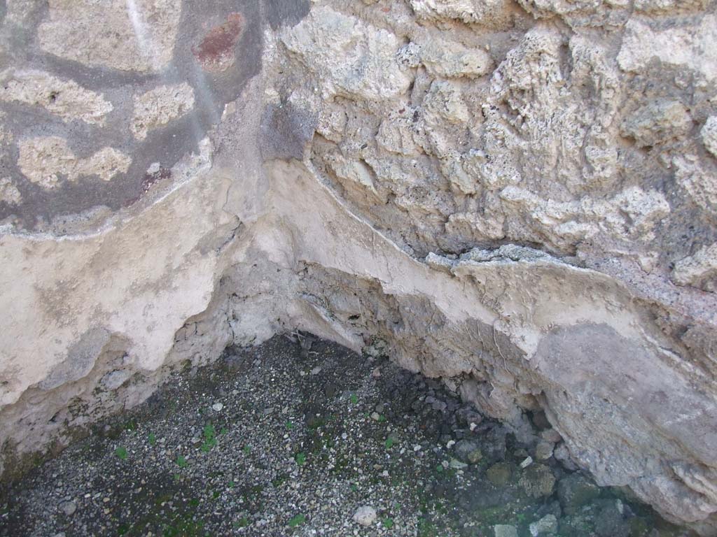 VI.14.43 Pompeii. December 2007. Room 10, remains of plaster in south-west corner.