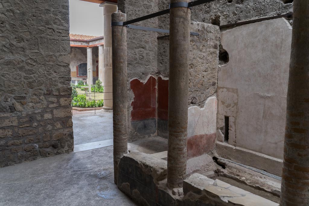 VI.15.1 Pompeii. March 2023. Looking south-west in courtyard “s” towards doorway to large peristyle “m”. Photo courtesy of Johannes Eber.