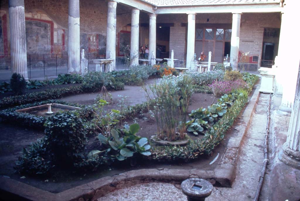 VI.15.1 Pompeii. December 1968. Looking across peristyle towards west wall, north-west corner and north wall.
Photo courtesy of Rick Bauer.

