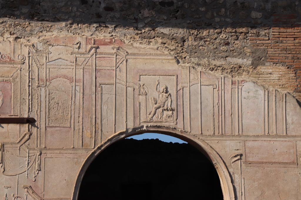 VII.1.8 Pompeii. October 2022. 
Looking west towards upper arch of nymphaeum F with stucco relief of a seated Zeus. Photo courtesy of Klaus Heese.
