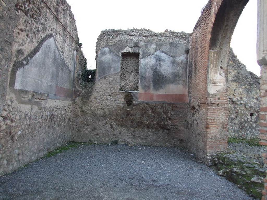 VII.1.8 Pompeii. December 2006. West, south and north walls of nymphaeum F.
The large oblong niche in the west wall was apparently for a statue. Below a jet of water spurted out just above the marble dado.
See Mau, A., 1907, translated by Kelsey F. W. Pompeii: Its Life and Art. New York: Macmillan, p. 197.
