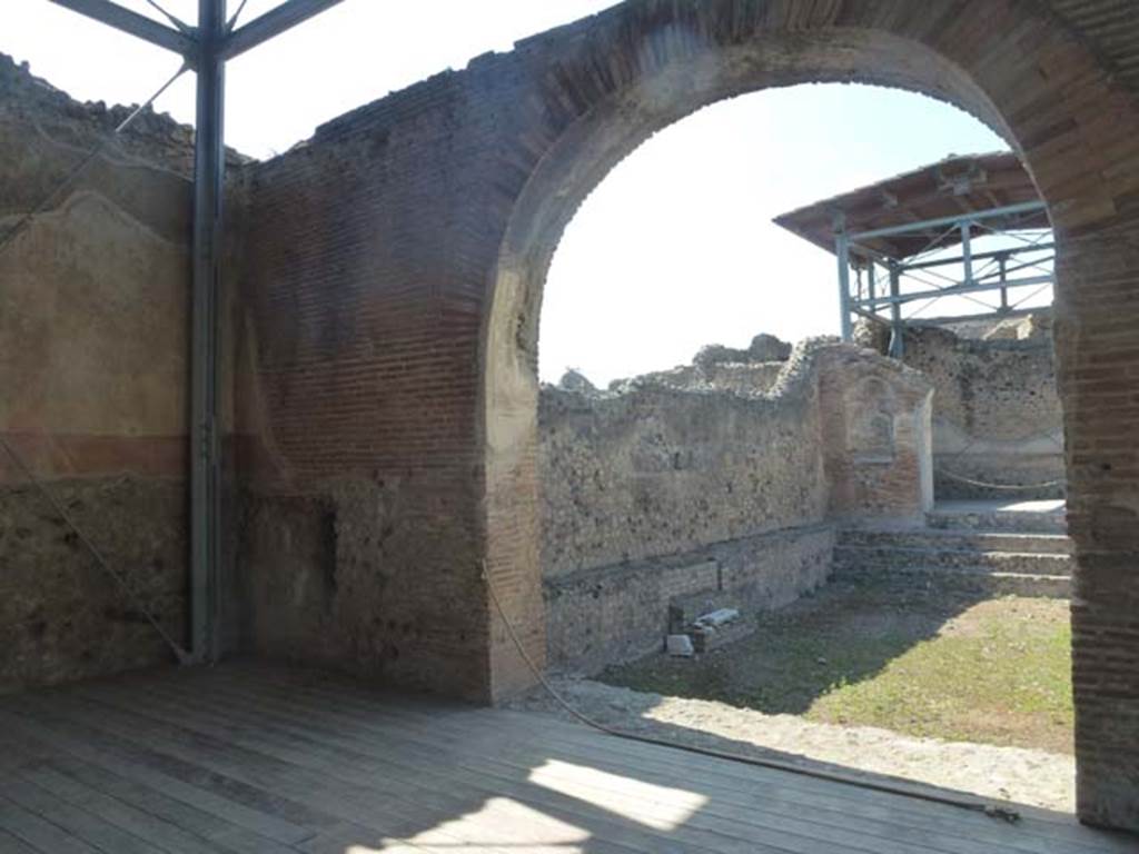 VII.1.8 Pompeii. June 2012. North wall of nymphaeum F, looking through arch to swimming pool D. Photo courtesy of Michael Binns.