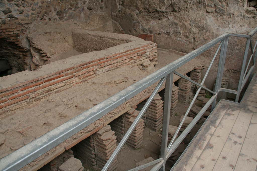 VII.1.8 Pompeii. April 2013. Men’s tepidarium 3, looking towards south-east corner, and detail of hypocaust system. 
Photo courtesy of Klaus Heese.
