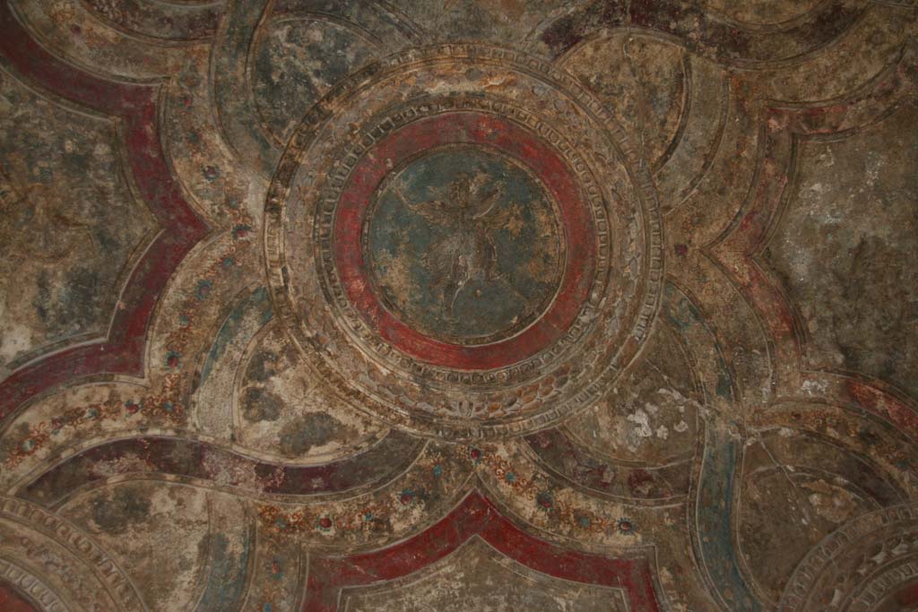 VII.1.8 Pompeii. April 2013. Stuccoed ceiling with cupid in vestibule 1, near the men’s changing room. 
Photo courtesy of Klaus Heese.
