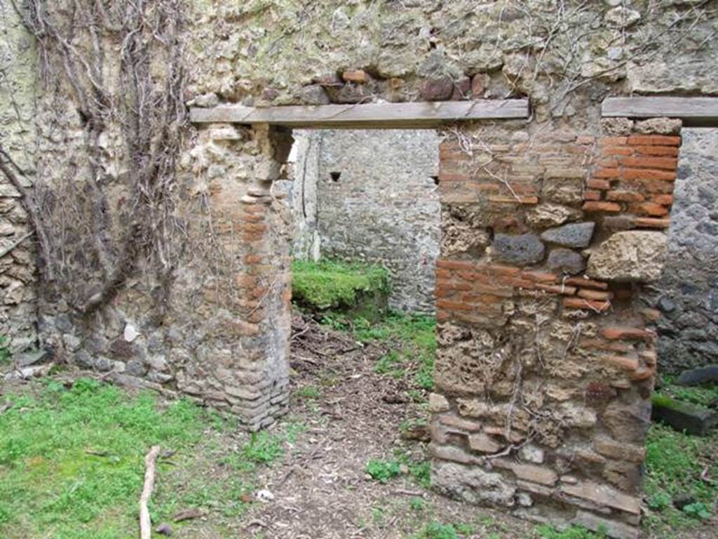 VII.3.4 Pompeii. March 2009.  Doorway to Kitchen, in south wall of garden.