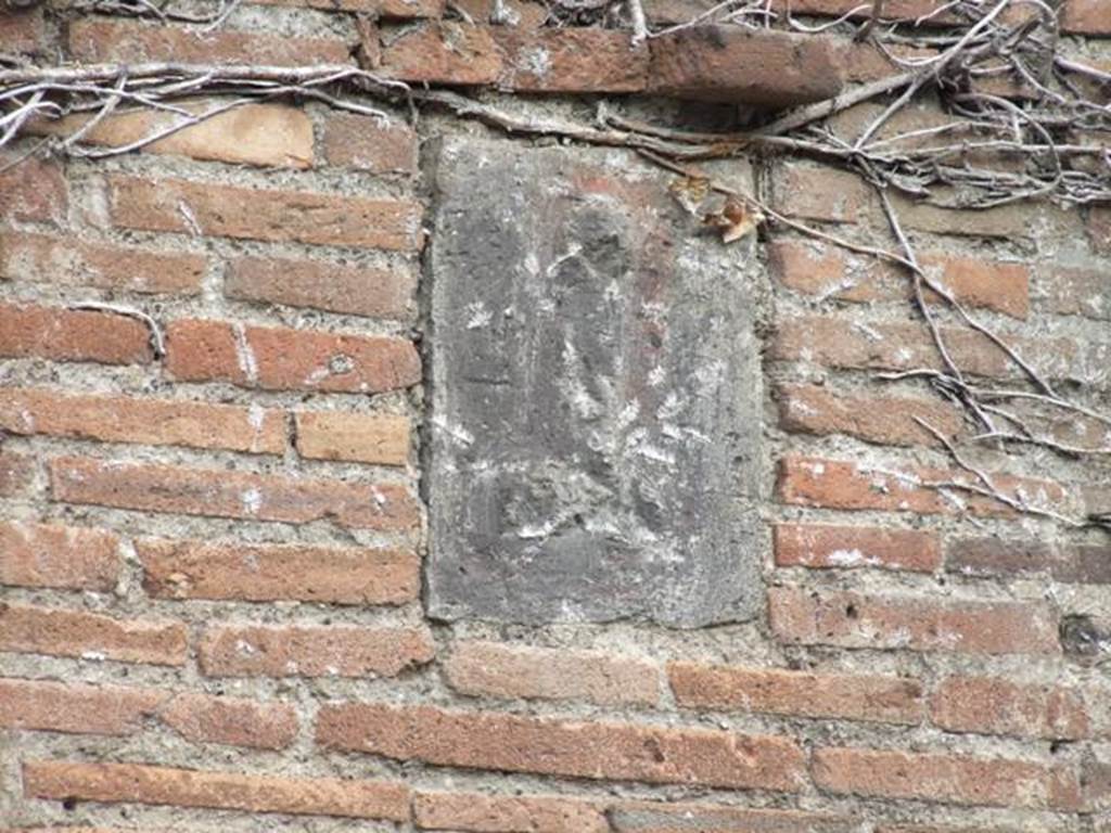 VII.4.27Pompeii. December 2007.   Plaque on pillar on west side of entrance.