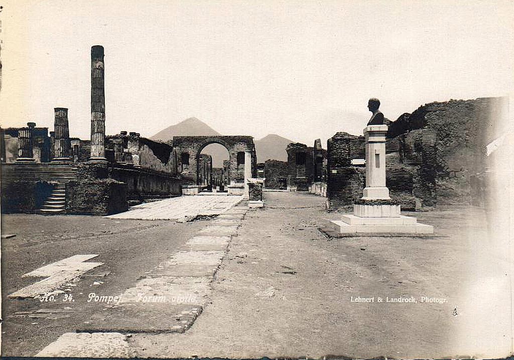 VII.8 Pompeii Forum. 1910. East side of Forum with bust of Giuseppe Fiorelli.
The bust is now in the Larario dei Pompeianisti. Photo courtesy of Ross Turner.
The bronze bust of Fiorelli was erected in the Forum at Pompeii in 1895, a year before his death.  
The inscription on the front of the pedestal reads:

          IOSEPHO FIORELLI
DE ANTIQVITA TIBUS POMPEIANIS
            OPTIME MERITO
       EX PVBLICO DECRETO
          CIVES VIVENTI CIVI
             POSVERVNT
              MDCCCXCV
