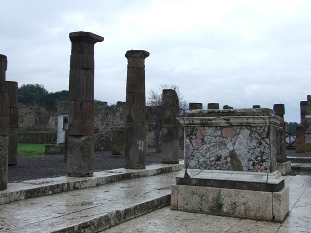 VII.8 Pompeii Forum. December 2007. North side of marble base in the south east corner. Red and black marble base for figure and horse, with Latin inscription on west side.