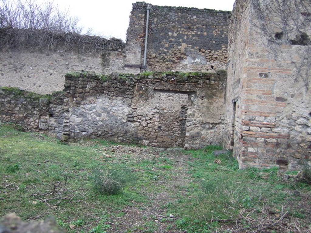 VII.11.1 Pompeii. December 2005. Looking west towards entrance doorway, taken over wall from VII.11.6.