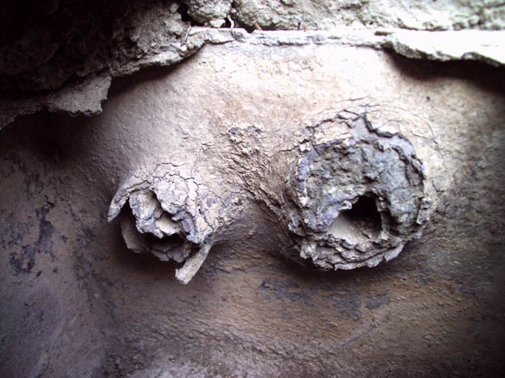 VII.12.11 Pompeii. July 2008. Detail from water feature on east side of oven. Photo courtesy of Jared Benton.
