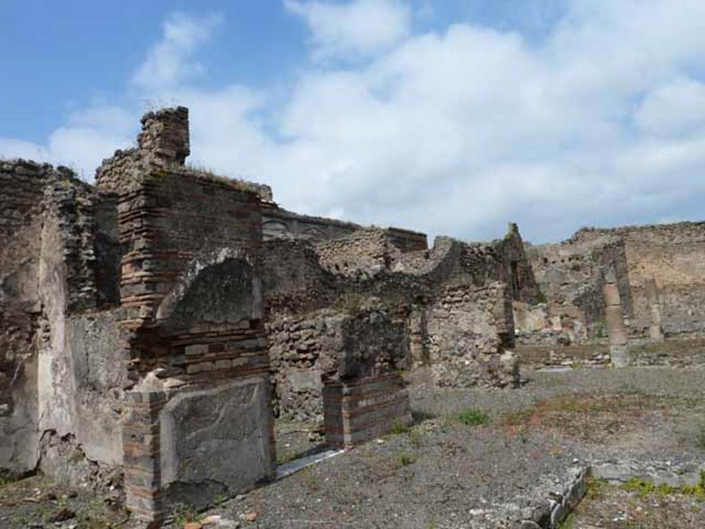 VII.13.4 Pompeii. May 2010. West side of atrium, with two doorways to cubicula and the ala.