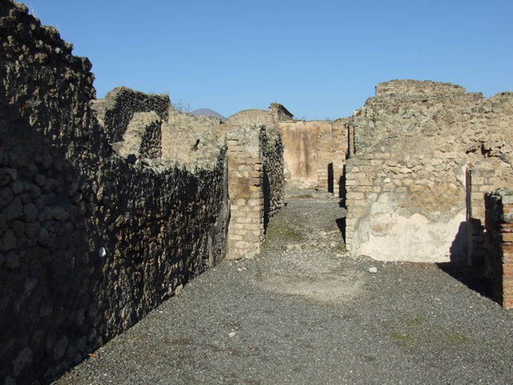 VII.14.14 Pompeii looking into VII.14.15. December 2006. Looking north to doorway to dwelling at rear, see VII.14.15.