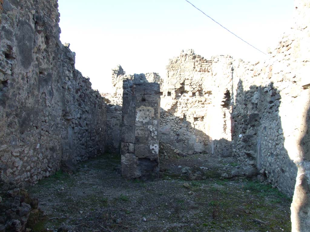 VII.15.6 Pompeii. December 2007. Looking north across shop-room towards rear rooms.
On the left would have been the steps to upper floor, on the right a room with window into VII.15.7.
