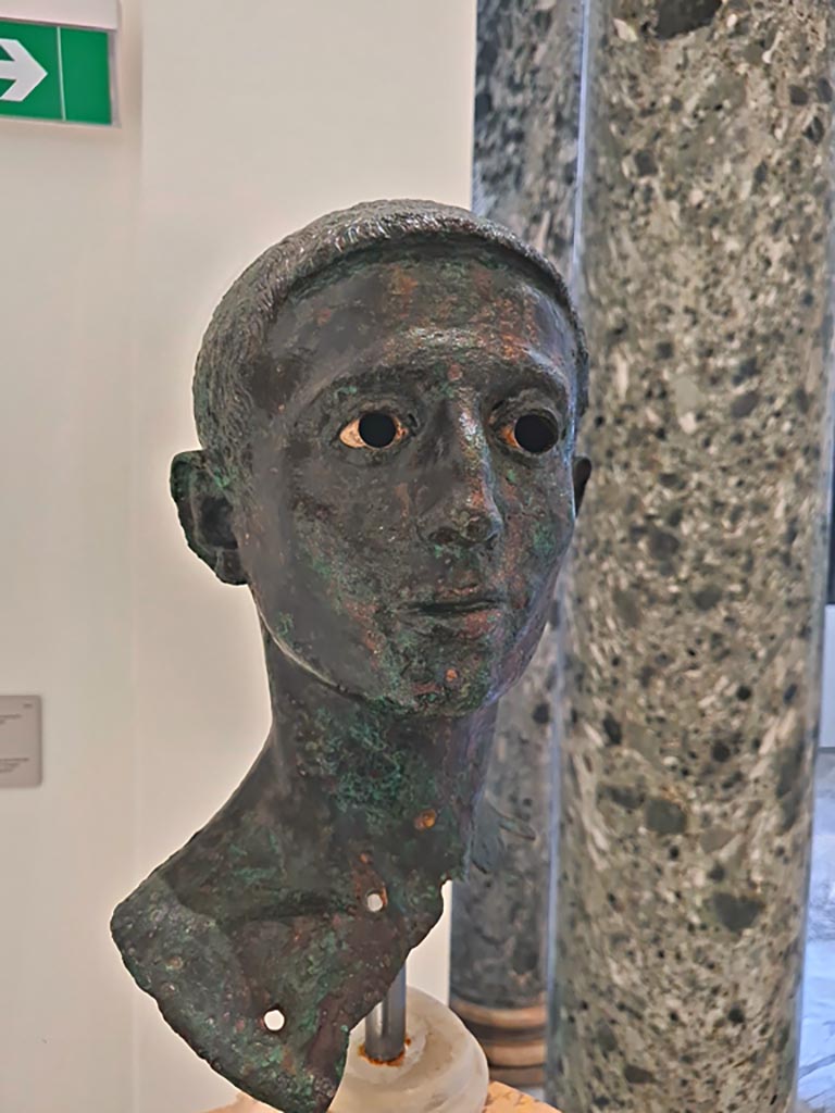 VIII.1.1 Pompeii. April 2023. Detail of bronze bust of a young unknown man, found in the Basilica. 
On display in “Campania Romana” gallery in Naples Archaeological Museum. Photo courtesy of Giuseppe Ciaramella.

