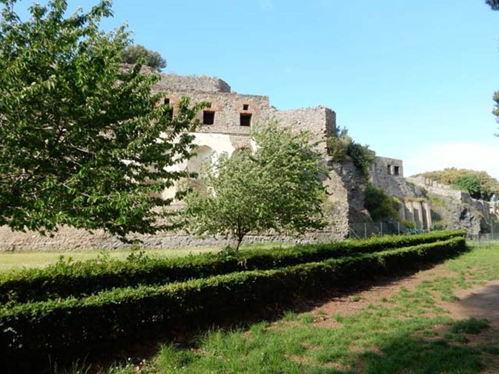 Rear of VIII.2.20/VIII.2.34 Pompeii. May 2015. Looking east along rear with Sarno Baths, left and centre. Photo courtesy of Buzz Ferebee.
