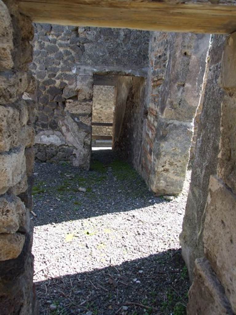 VIII.5.9 Pompeii.  March 2009.  Room 15. Corridor. Looking east to rear entrance at VIII.5.13