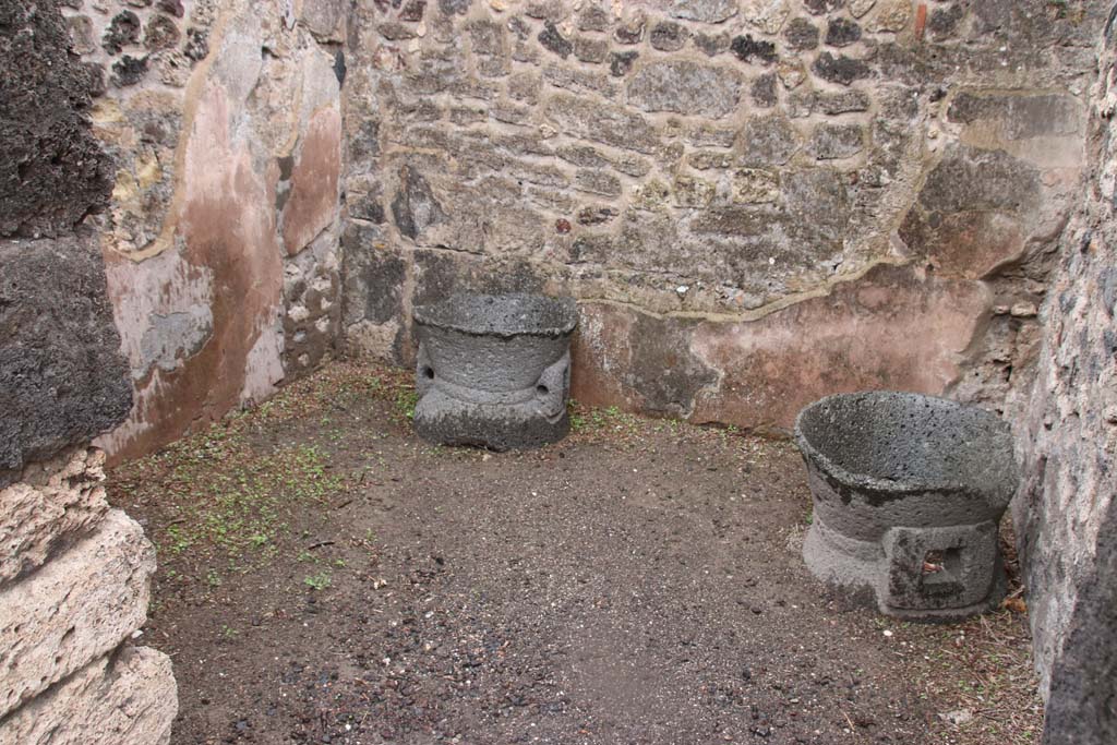 VIII.6.11 Pompeii. October 2020. Looking east through doorway to room in north-east corner of bakery. (room E). Photo courtesy of Klaus Heese.