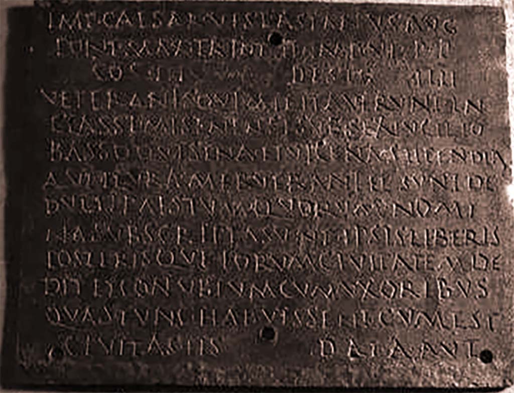 VIII.7.8 Pompeii. Inner part 3 of decree of discharge of M. Surus Garasenus.
Now in Naples Archaeological Museum. Inventory number 110043.

The Epigraphic Database Roma records

Ìmp(erator) Caesar Vespasianus Aug(ustus),
pont(ifex) max(imus), tr(ibunicia) pot(estate) I̅I̅, imp(erator) VI, p(ater) p(atriae),
co(n)s(ul) III, desig(natus) I̅I̅I̅I̅,
veteranìs, quì militaverunt in
classe Misenensi sub Sex(to) Lucilio 
Basso, quì sena et vicena stipendia
aut plura meruerant et sunt de=
ductì Paestum, quorum nomi=
na subscripta sunt, ipsis liberis
posterisque eorum civitatem de= 
dit et conubium cum uxoribus,
quas tunc habuissent, cum est
cìvitas iìs data, aut,      [CIL X 867]
