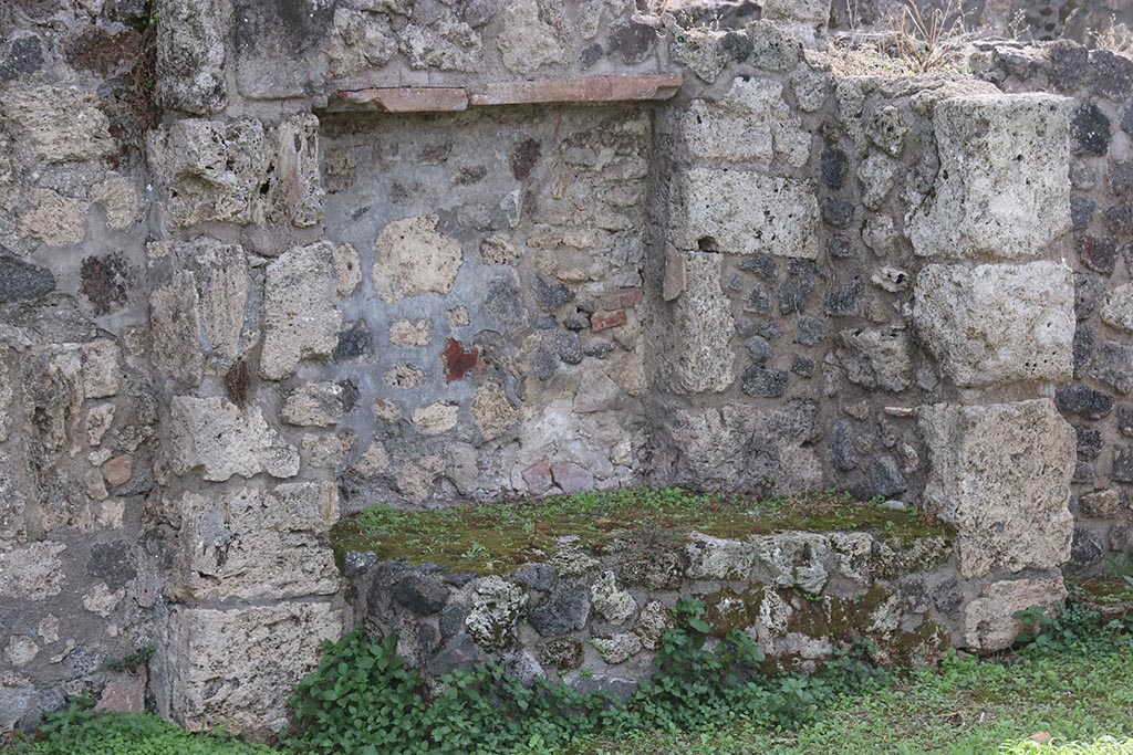 VIII.7.8 Pompeii. October 2024. Looking south at kitchen with bench, near south wall of shop. Photo courtesy of Klaus Heese.