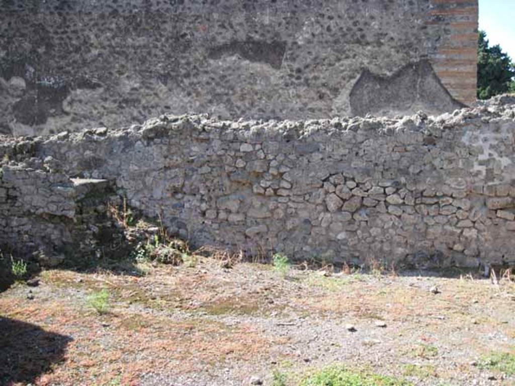 VIII.7.26 Pompeii. September 2010. West wall of main entrance room, with steps to upper floor. Looking towards Temple of Isis. Photo courtesy of Drew Baker.

