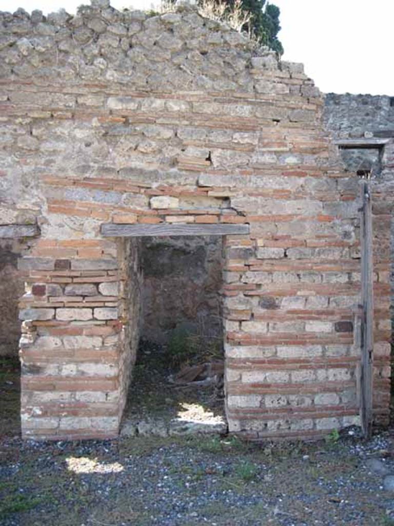 VIII.7.26 Pompeii. September 2010. Looking west towards first doorway to room in north-west corner of atrium. Photo courtesy of Drew Baker.
