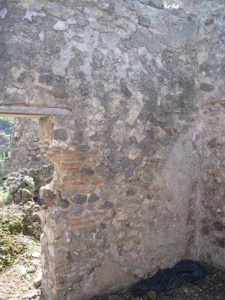 VIII.7.26 Pompeii. September 2010. South wall and south-west corner, looking south through doorway towards north portico. Photo courtesy of Drew Baker.
